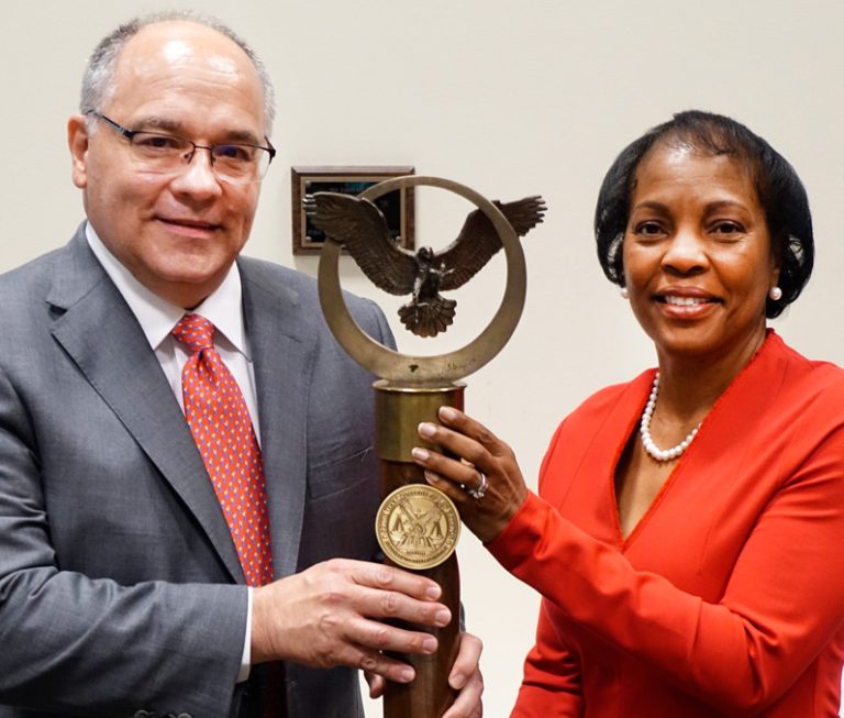 J. Ken Johnson ’86 passes the mace to Boykins